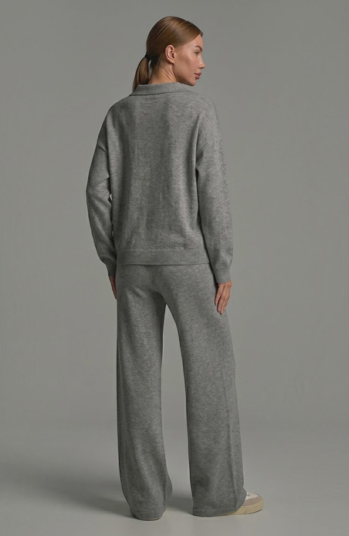 LORVENES knit trouser set featuring a cozy top and matching wide-leg knit trousers, styled on a female model.