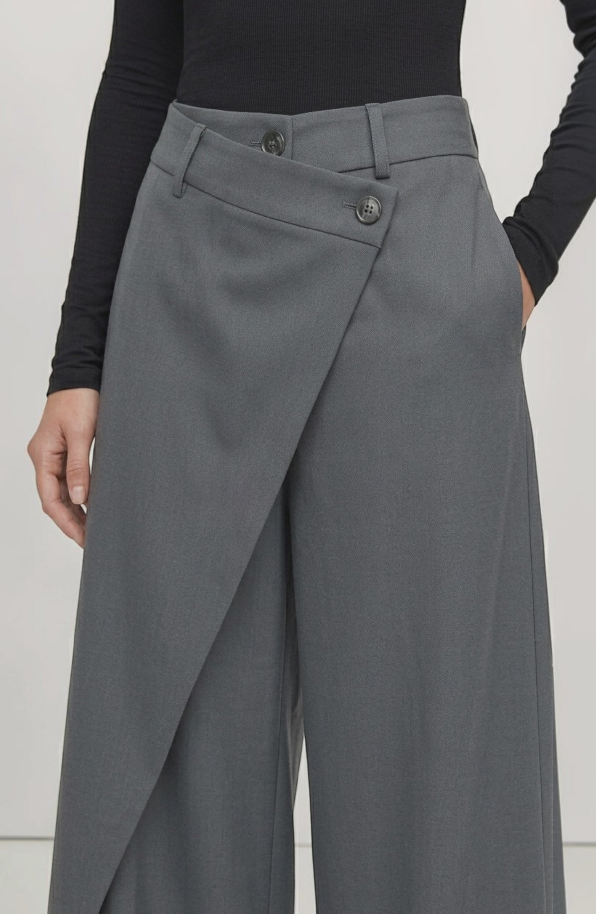 LORVENE Curve Form Pants displayed from the bottom left angle, showcasing the fit and fabric texture of the stylish trousers.