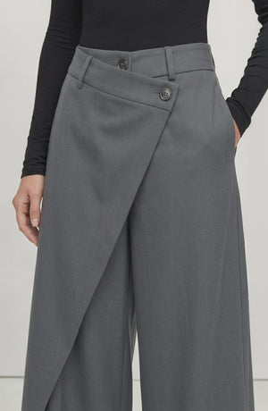 LORVENE Curve Form Pants displayed from the bottom left angle, showcasing the fit and fabric texture of the stylish trousers.