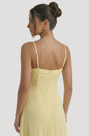 LORVENE Pure Ruffle Maxi dress with flowing fabric and ruffle details, shown from the bottom right angle.