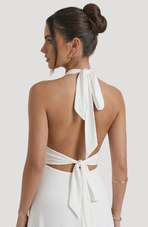 LORVENE Luxe Draped Dress shown from the bottom right angle, highlighting its elegant fabric and flowing design.