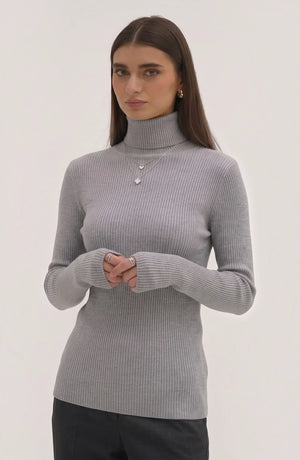 LORVENE pure soft polyester high neck top in a neutral color, showcasing its smooth fabric and high neckline design.