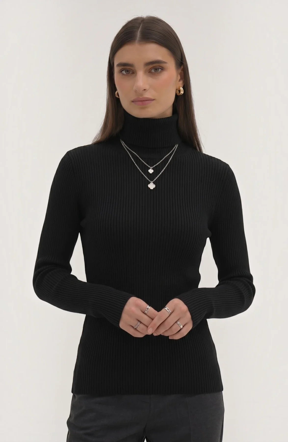 Soft polyester high neck top by LORVENE, featuring a smooth fabric and a classic high neckline, shown in a front view.