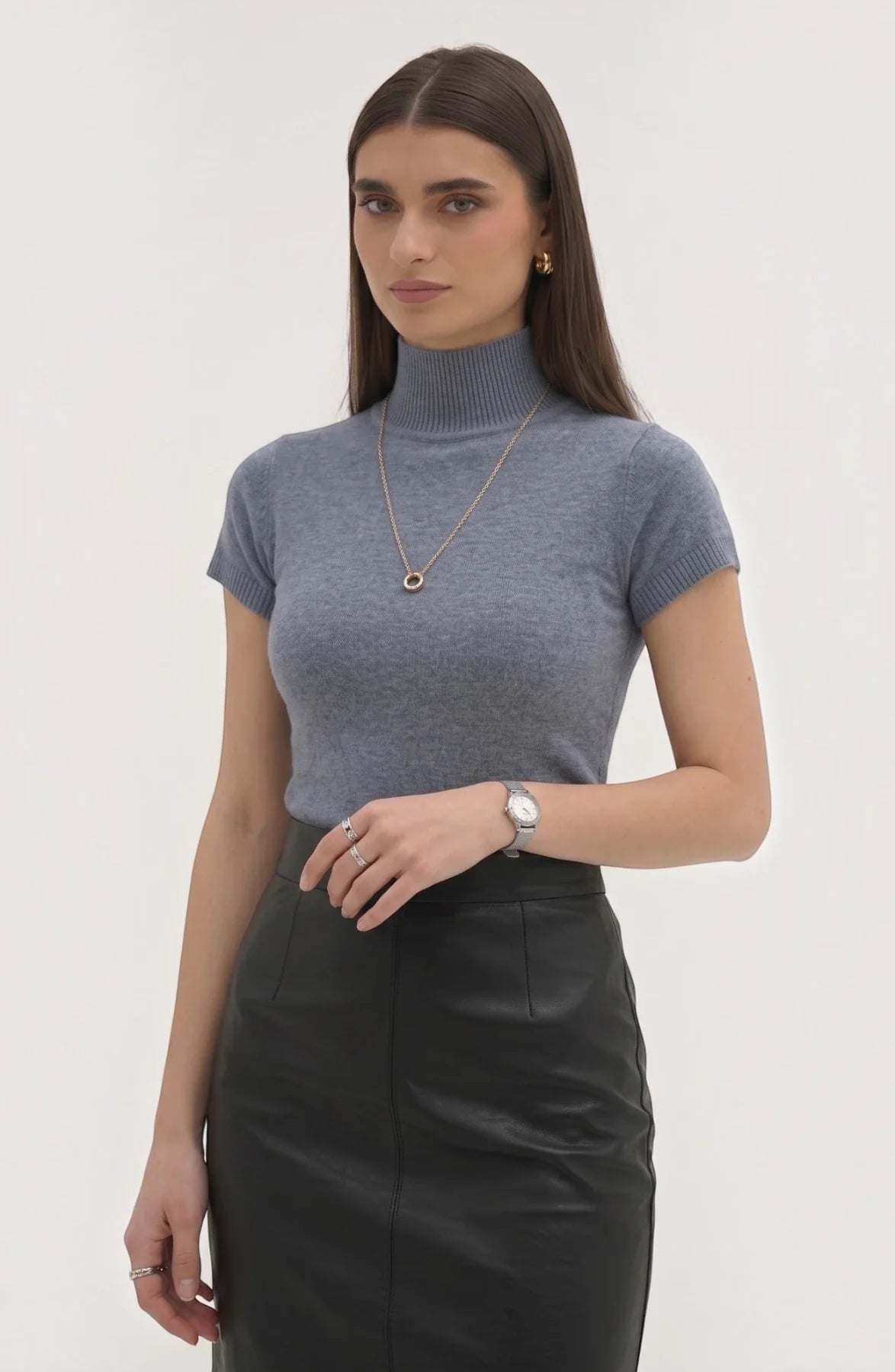 LORVENE Pure Poly Blend High Neck sweater in neutral color, close-up of the soft fabric and high neckline detail.