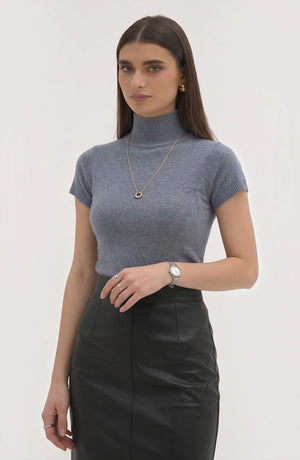 LORVENE Pure Poly Blend High Neck sweater in neutral color, close-up of the soft fabric and high neckline detail.