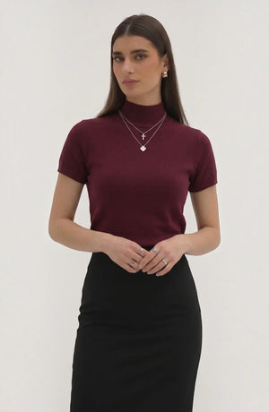 LORVENE pure poly blend high neck top displayed on a hanger with a close-up view of the fabric and neckline.