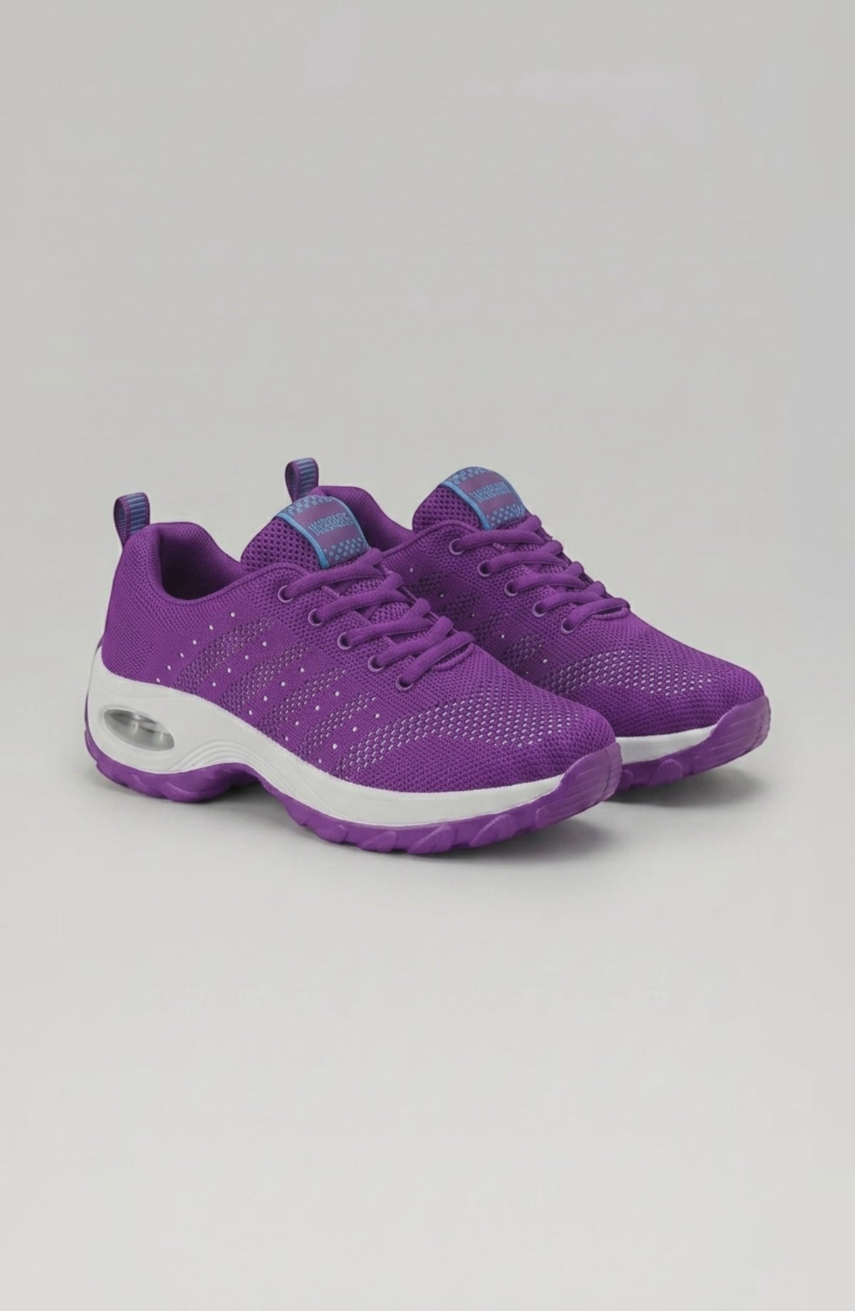 LORVENE Ice Walk sneakers in white with textured soles, designed for winter traction and outdoor walking.