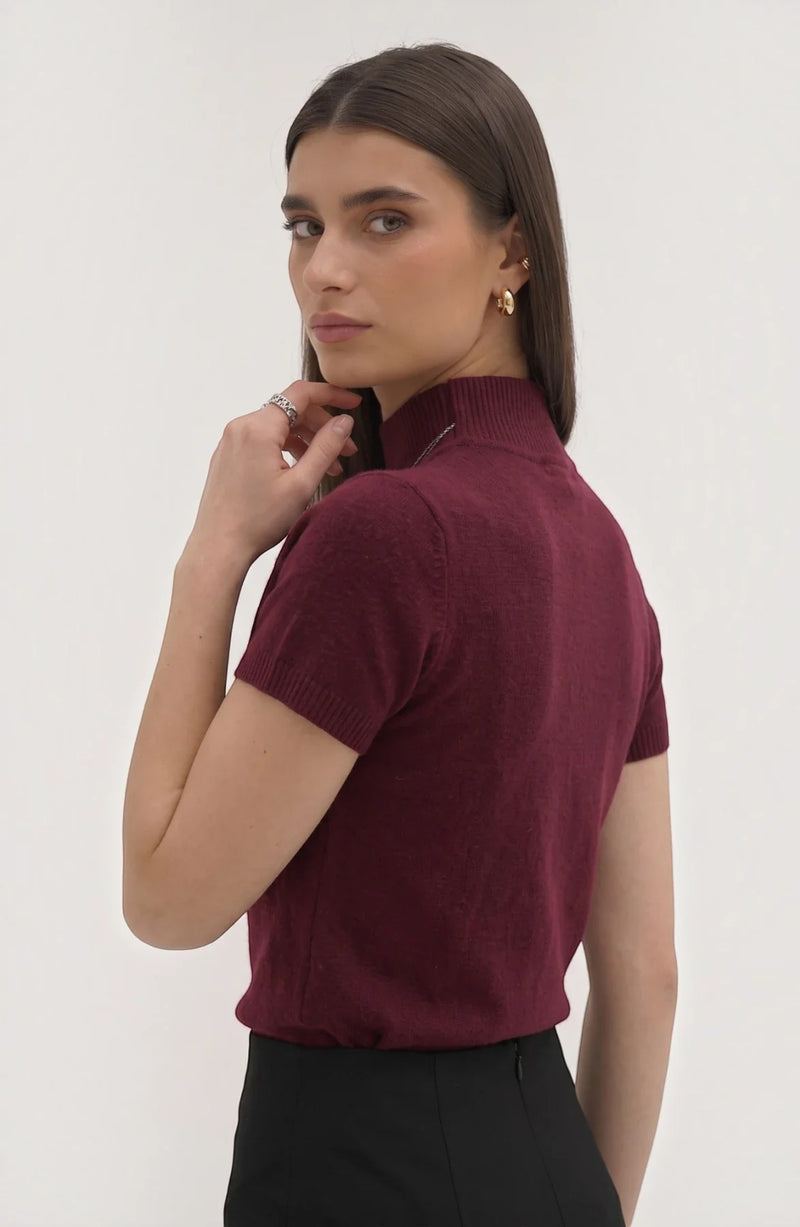 LORVENE pure poly blend high neck top, shown in black with a close-up of the fabric and high neckline design.