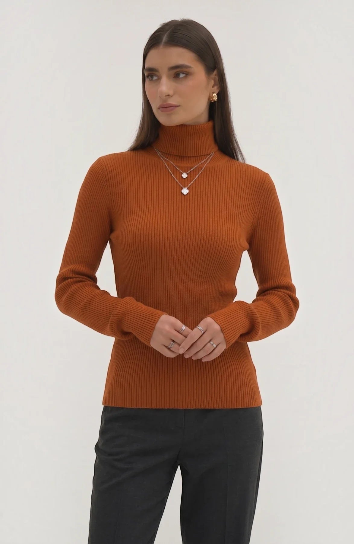 LORVENE Pure Soft Polyester High Neck top in black with a close-up view of the fabric and high neckline detail.