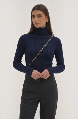LORVENE pure soft polyester high neck top in neutral color, close-up view of fabric and high neckline detail.