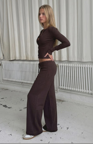 Sexy European and American pure desire knitted suit Slim button slimming long sleeve low waist casual trousers two-piece suit for women