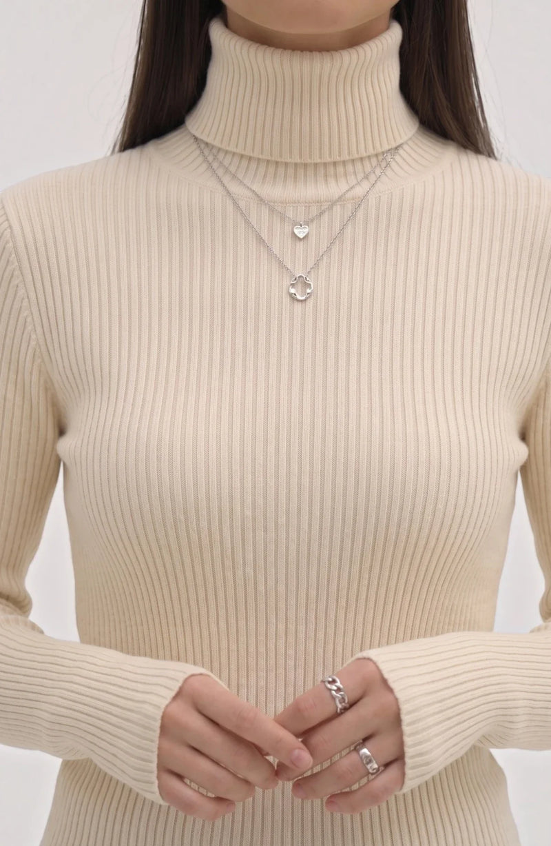 LORVENE pure soft polyester high neck top with a close-up view of the smooth fabric and high neckline design.