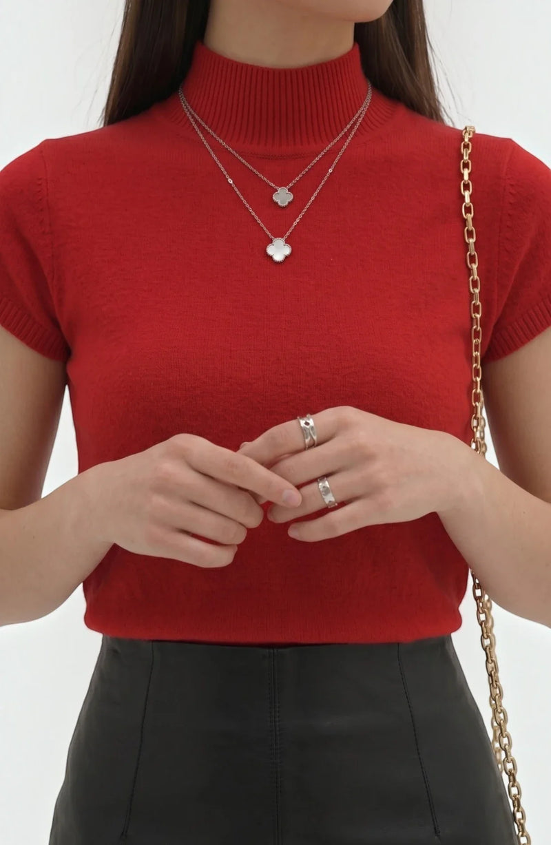 LORVENE Pure Poly Blend High Neck top, soft fabric with a fitted high neckline, shown in a close-up view.