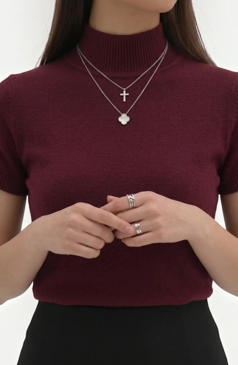 LORVENE pure poly blend high neck top in neutral color, close-up showing fabric texture and high neckline style.