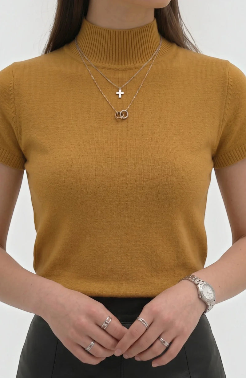 LORVENE Pure Poly Blend High Neck top featuring a fitted silhouette and high neckline, shown in a close-up image.