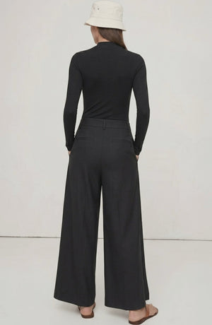 LORVENE Curve Form Pants in a top-right pose, showcasing fitted high-waisted design and stylish tailoring.