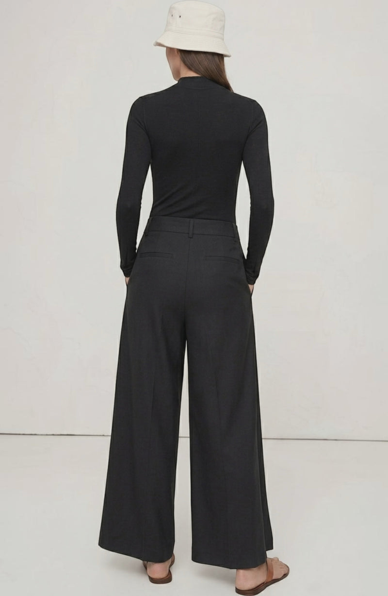 LORVENE Curve Form Pants in a top-right pose, showcasing fitted high-waisted design and stylish tailoring.