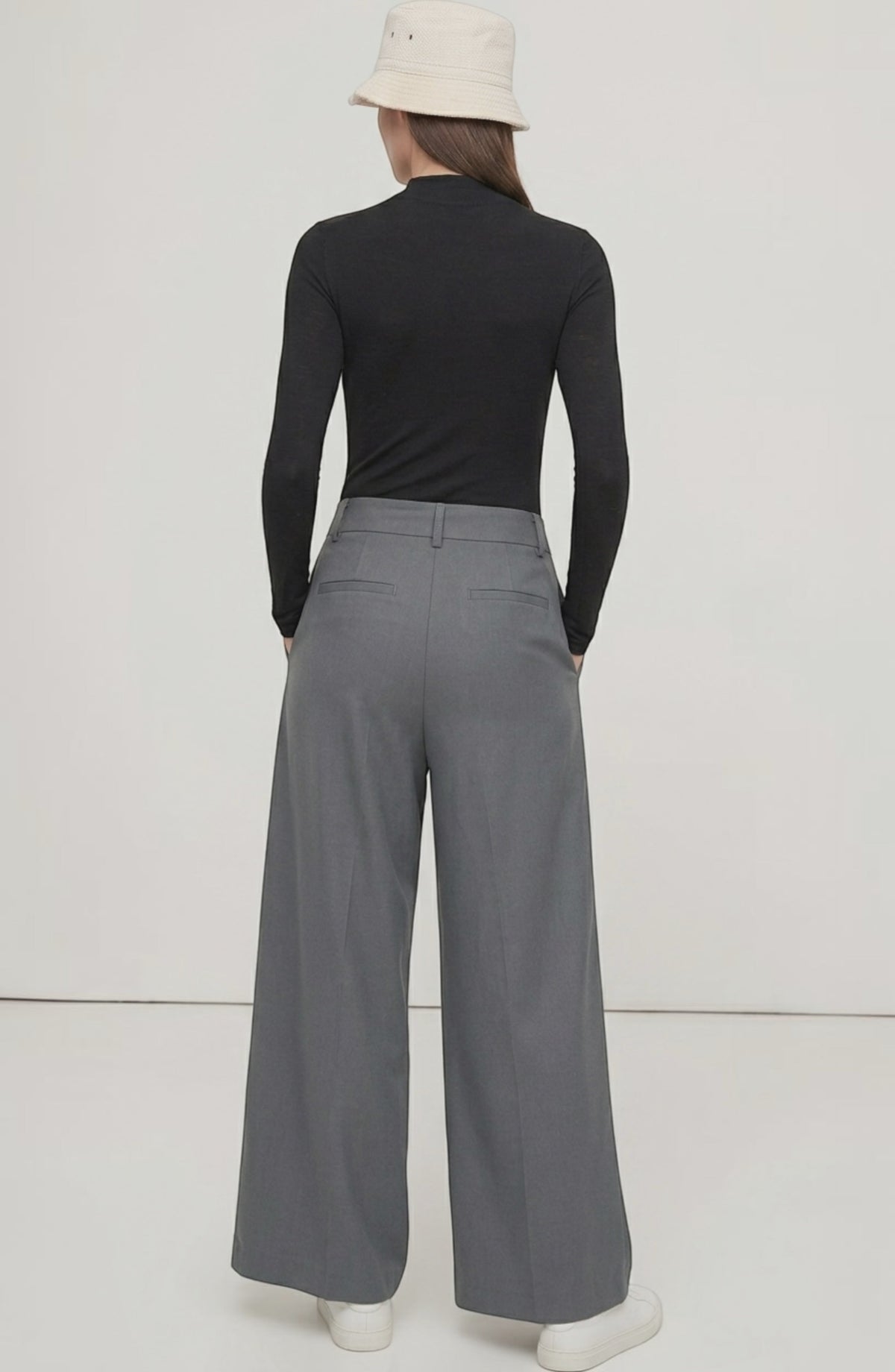 LORVENE Curve Form Pants modeled in a top-right pose, showcasing their sleek fit and modern design.