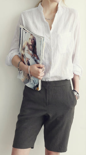LORVENE classic button-up shirt in crisp fabric, featuring a collared neckline and long sleeves, displayed flat on a white background.