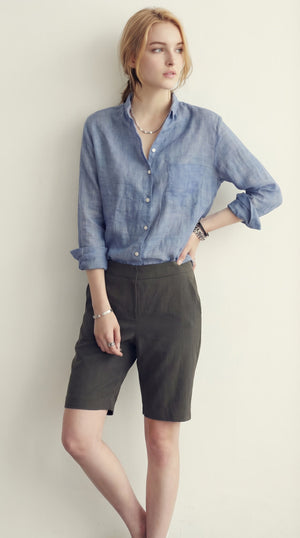 LORVENE classic button-up shirt in light blue with a collar and long sleeves, displayed on a hanger.
