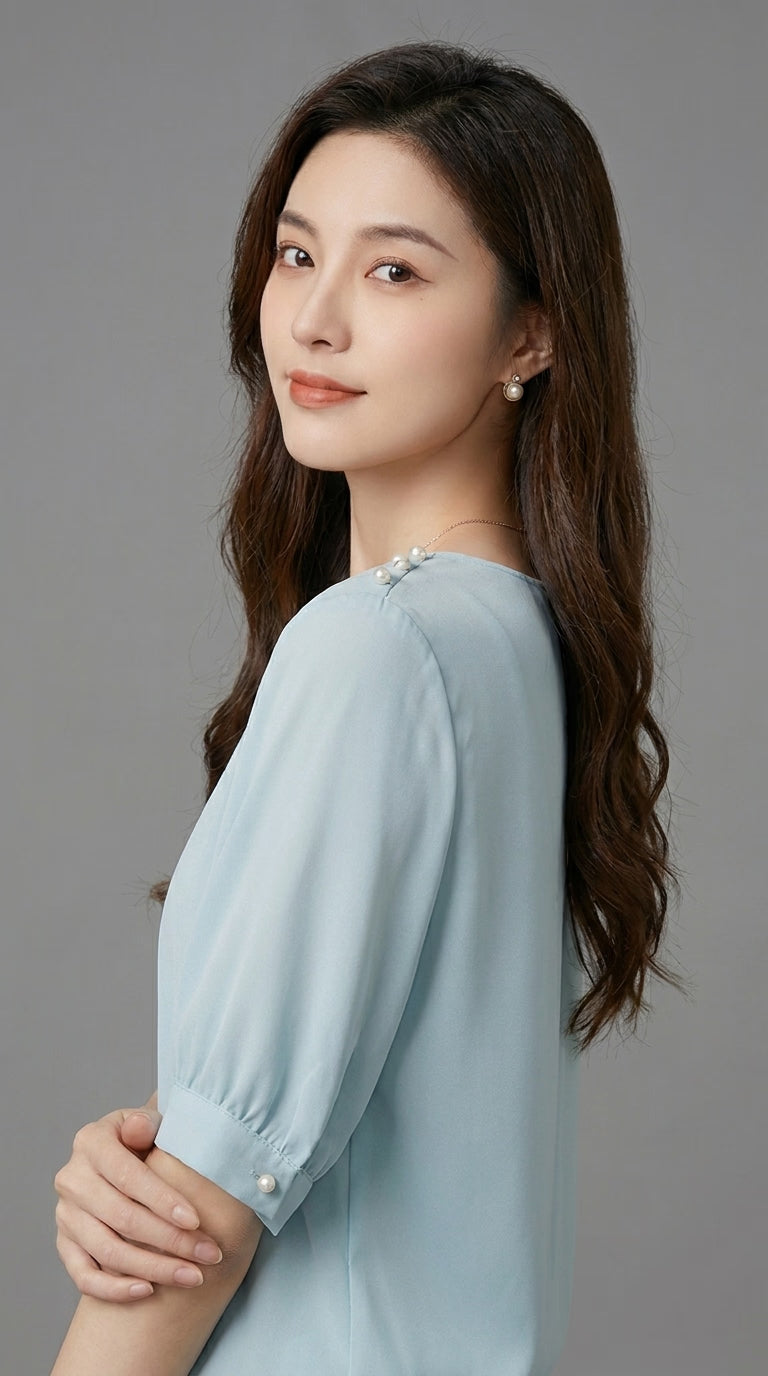 LORVENE chic blouse shirt with long sleeves and button-down front, shown on a hanger in a natural fabric setting.