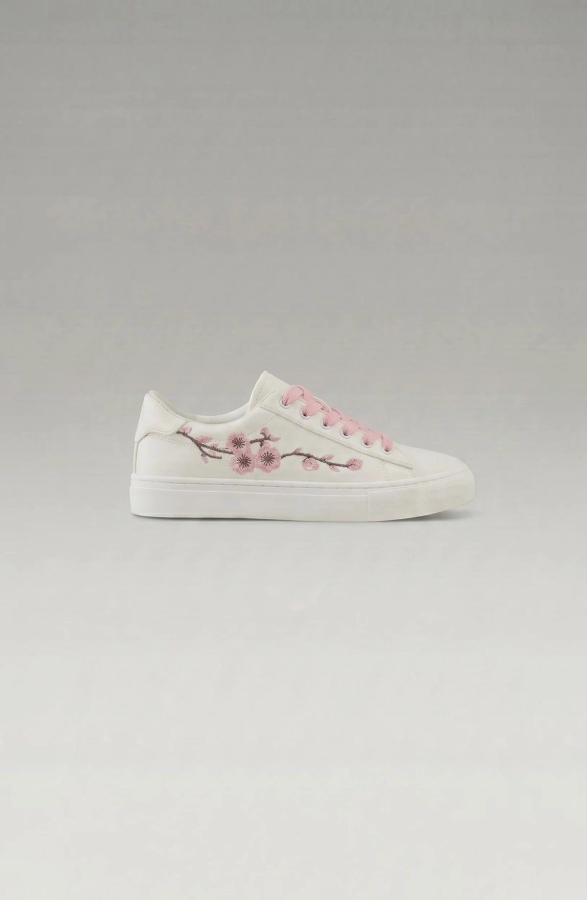 LORVENE Crystal Tone sneakers with clear crystal accents and white rubber soles, stylish casual footwear for everyday wear.