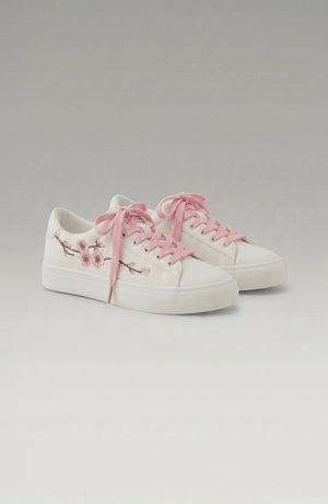 LORVENE Crystal Tone Sneakers featuring clear and sparkling design with white soles and stylish accents.