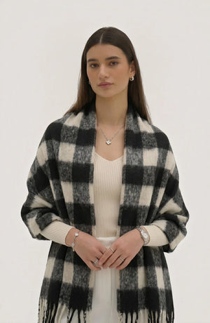 LORVENE lightweight evening shawl draped over a chair, soft fabric in neutral tones, suitable for formal or special occasions.