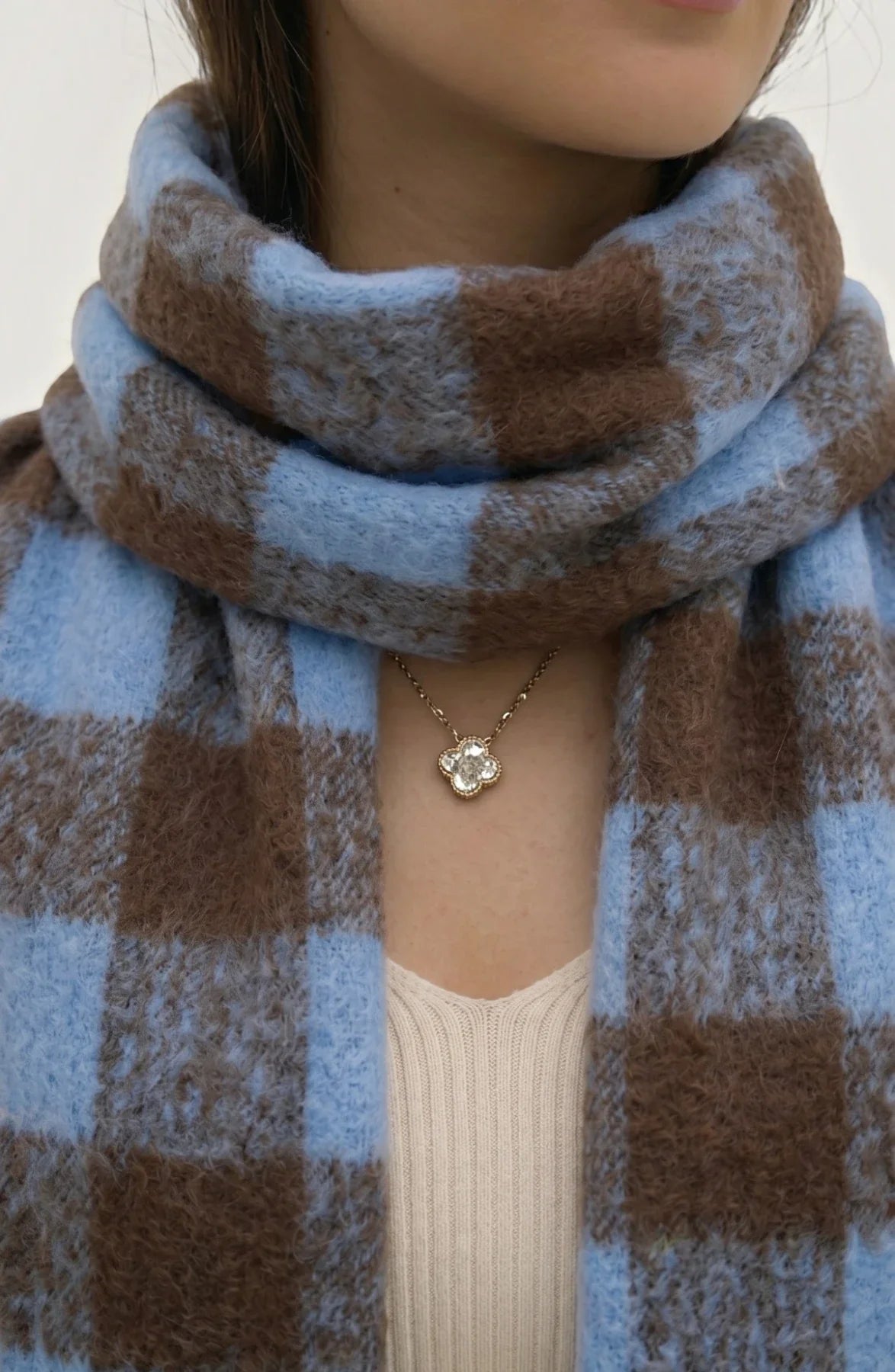 LORVENE lightweight evening shawl in soft fabric, draped elegantly with intricate detailing on a neutral background.