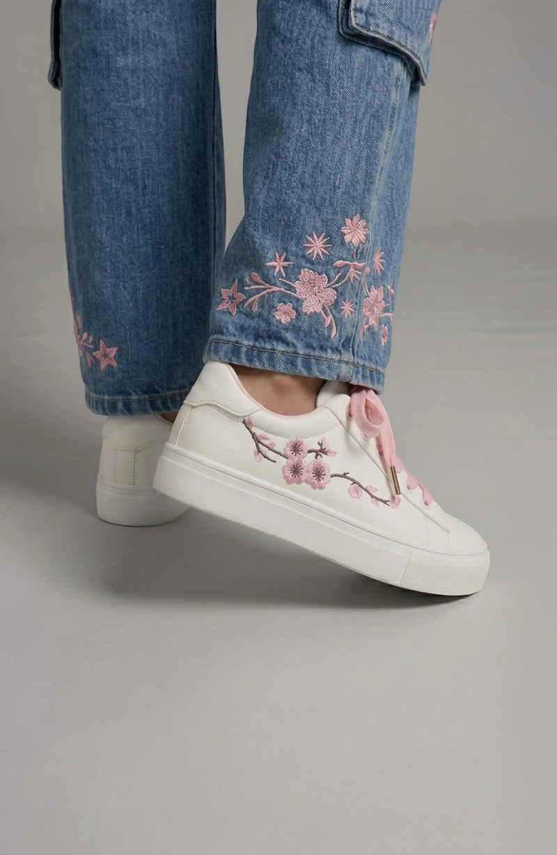 LORVENE Crystal Tone sneakers featuring clear crystal accents, white laces, and a stylish casual design for everyday wear.