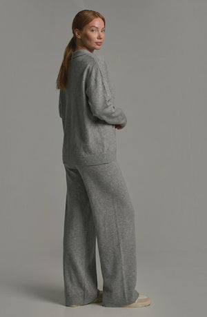 LORVENES knit trouser set featuring a cozy, stylish top and matching trousers displayed on a model in a fashion photoshoot.