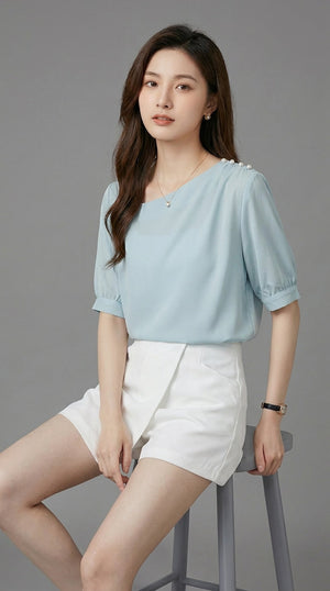LORVENE chic blouse shirt with a stylish collar and long sleeves, displayed on a hanger against a neutral background.