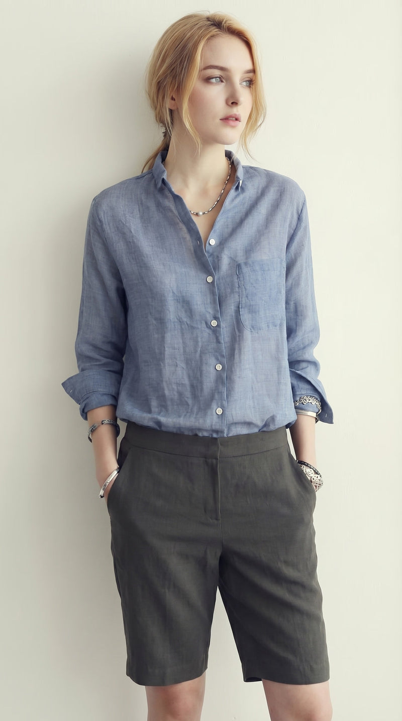 LORVENE classic button-up shirt in white, featuring a collared neckline and long sleeves, displayed on a hanger.